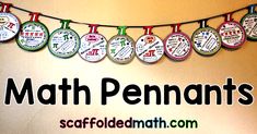 there are many magnets hanging from the line on the wall that says math pennants