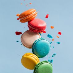 colorful macaroons are flying in the air