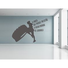 an empty room with a large wall decal in the shape of a woman carrying a wheelbarrow