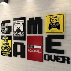 there are many different signs on the wall in this room, including video games and gaming consoles