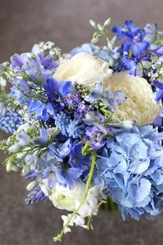 a bouquet of blue and white flowers