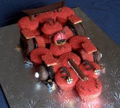 a cake made to look like a car with red frosting