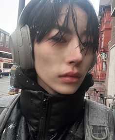 a young man with headphones on his ears