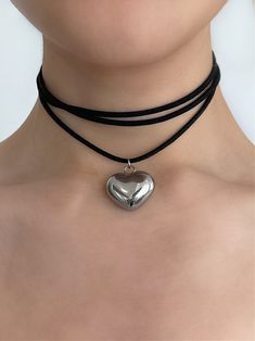 Oh it’s love... This crush-worthy necklace is seriously giving us hearts for eyes. Meet the 'LUV U' suede wrap choker - featuring an adorable 3D heart pendant strung alongside faux black suede leather, this piece is guaranteed to get the compliments rolling in! Made with stainless steel pendant and faux black suede leather cord. 50" length - designed to allow you to tie this piece in multiple ways. Handmade in Los Angeles. Trendy Adjustable Choker For Valentine's Day, Adjustable Heart Charm Choker For Party, Adjustable Heart Pendant Choker For Parties, Adjustable Choker For Valentine's Day, Trendy Heart Pendant Choker For Valentine's Day, Valentine's Day Heart Choker Necklace, Trendy Adjustable Heart Necklace For Party, Adjustable Trendy Heart Necklace For Party, Trendy Adjustable Heart Choker Necklace