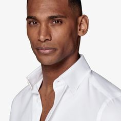 A classic all-occasion pick, this handsome white button-up is cut from crease-resistant Traveller two-ply cotton. Tailored to a slim fit, it features a classic collar and single cuff. Modern White Dress Shirt With Button Closure, Elegant Business Tops Wrinkle-resistant, Elegant Wrinkle-resistant Business Top, Classic Collared Shirt Wrinkle-resistant, Classic Collared Shirt, Wrinkle-resistant, Timeless White Shirt With Fold Down Collar, Classic Wrinkle-resistant Business Tops, Elegant Business Top With Wrinkle-resistant Fabric, Timeless White Cotton Dress Shirt