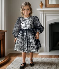 ✿ABOUT THIS DRESS ✓Our handmade dress is perfect for special occasions such as recitals, pageants, and official invitations.  ✓The elegant white satin bodice is adorned with delicate black floral embroidery, adding a touch of sophistication to the dress. ✓The long-sleeved is made of fluffy tulle, creating a dreamy and romantic look. ✓The dress is lined with 100% cotton, ensuring your little one stays comfortable throughout the event.  ✿FABRIC INFORMATION ✓Natural cotton lining 100% under the ski Elegant A-line Pageant Dress, Elegant A-line Dresses For Pageant, Elegant Holiday Dress For Spring Dress-up, Elegant Spring Holiday Dress For Pageant, Fitted Satin Princess Dress For Pageants, Elegant Dresses For Holiday Pageants, Elegant Satin Pageant Dress, Spring Satin Dress For Dress-up Occasions, Elegant Fitted Princess Dress For Spring