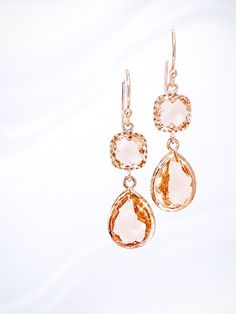 These Champagne Rose Gold Earrings make an elegant addition to any outfit and are perfect for weddings and special occasions. Customizable for a personal touch Made with high-quality gold Ideal as a wedding gift or bridesmaid gift The unique rose gold design adds a touch of luxury to any look, making these earrings the perfect accessory for special events. The customizable feature allows you to make them your own, ensuring that they will be cherished as a personalized keepsake long after the eve Elegant Rose Gold Earrings For Gift, Rose Gold Drop Bridal Earrings For Formal Occasions, Formal Rose Gold Drop Bridal Earrings, Formal Rose Gold Bridal Drop Earrings, Delicate Rose Gold Bridal Earrings Gift, Elegant Champagne Jewelry For Gift, Elegant Gold Bridal Earrings For Wedding Gift, Elegant Peach Earrings For Wedding, Elegant Orange Earrings For Gift