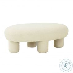 a white foot stool with four legs