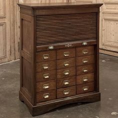 an old wooden cabinet with many drawers