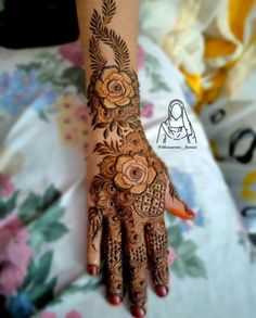 a woman's hand with hennap and flowers painted on the palm,