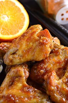 chicken wings with oranges and spices on the side, ready to be eaten for lunch