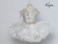 Drop dead gorgeous is this stunning winner Sugar Kayne girls cupcake pageant special occasion ruffled organza dress will make jaws drop! Have your little princess l"WoW" the crowd at her next pageant in this fun organza cupcake dress. A hand beaded bodice with accent stone colors and off-the-shoulder straps make this cupcake dress fun to wear! The corset back allows for easy adjustments. Johnathan Kayne understands how important your child's special occasion is and what it takes to make you and Fitted White Organza Pageant Dress, White Princess Organza Pageant Dress, White Princess Pageant Dress In Organza, Princess Style Organza Pageant Dress, White Princess Style Organza Pageant Dress, White Princess Style Pageant Dress In Organza, White Elegant Pageant Dress With Ruffles, Elegant White Pageant Dress With Ruffles, White Ruffled Pageant Dress For First Communion