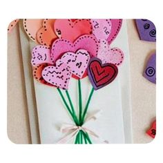 valentine's day card with paper flowers and hearts