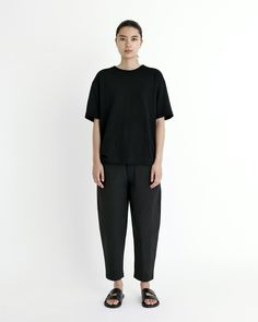 A t-shirt for everyday wear. Designed with a relaxed, boxy fit in a regular length, with slightly longer sleeves. Crafted out of a soft linen cotton jersey with a refined handfeel. + Details Color: Black 55% Linen, 45% Cotton XS, S, M, L, XL Julie is 5'9" and wearing a S Junho is 6'0" and wearing a M Hand wash cold, lay flat to dry. Can be machine washed cold. Do not tumble dry. Can be dry cleaned. + Material A smooth linen-cotton jersey with a substantial weight to it. This material offers brea Modern Boxy Fit T-shirt For Everyday, Relaxed Fit Cotton T-shirt For Day, Cotton Relaxed Fit T-shirt For Daywear, Relaxed Boxy T-shirt For Everyday, Everyday Relaxed Linen T-shirt, Black Crane, Friend Outfits, Unisex Accessories, Signature Collection