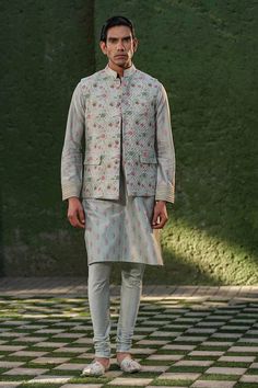 Blue sleeveless Nehru jacket with floral print and quilted pattern. Paired with floral print kurta and churidar. - Aza Fashions Kurta Set For Men, Nehru Jacket, Nehru Jackets, Quilted Pattern, Jacket Pattern, Churidar, Kurta Set, Blue Silk, Mandarin Collar