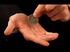 a person holding a coin in their hand