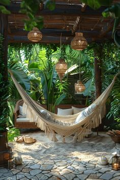 a hammock hanging from a pergolated area with lots of greenery