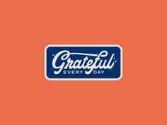 a blue and orange sticker with the words grateful every day written in white on an orange background