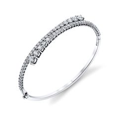 Elevate your wrist game with our exquisite Diamond Bypass Bangle Bracelet, an emblem of luxury and sophistication. This bracelet showcases round diamonds meticulously set in a stunning bypass design, radiating timeless beauty White Gold Cuff Bracelet With Single Cut Diamonds, Diamond Cuff Bracelet With Diamond Accents, Timeless Diamond Cuff Bracelet In Bangle Shape, Formal Cuff Bracelet With Brilliant Cut Diamond, Timeless Round Cuff Bracelet With Single Cut Diamonds, Elegant Round Cuff Bracelet With Diamond Accents, Formal Diamond Cuff Bracelet With Brilliant Cut, White Gold Jubilee Cuff Bracelet With Cubic Zirconia, Elegant Cuff Bracelet With Brilliant Cut