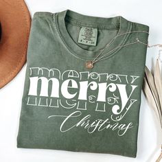 If you're looking for a thoughtful and practical gift, our apparel is sure to be appreciated by anyone who receives it. These holiday tshirts are handmade to order on an ultra-soft shirt that will quickly become your go-to apparel item! Our trendy Merry Christmas tees are made with eco-friendly water-based ink that feels good and lasts longer! You will never want to take it off! ♥Sizing info♥ *Unisex sizing. *Order your true size for a more fitted feel. Size up for a slouchier look ♥Care Instructions♥ *Wash on cold *Hang dry or tumble dry on low heat *Non-chlorine bleach only *Do not iron directly on the design ♥Shipping♥ 🚚Every order (no matter how large) ships same or next business day! We want you to receive your garment as quickly as you can so you can start enjoying it! 📦Free shippi Christmas Letter Print T-shirt Gift, Christmas Cotton T-shirt With Text Print, Christmas Green Cotton T-shirt, Christmas Green T-shirt With Letter Print, Green Christmas T-shirt With Letter Print, Christmas Cotton T-shirt With Screen Print, Holiday Green T-shirt With Letter Print, Christmas T-shirt With Text Print For Gifting, Christmas Gift T-shirt With Text Print