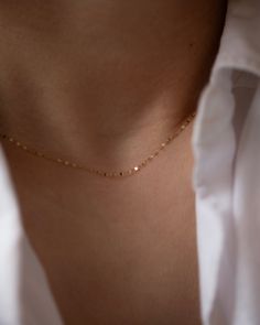 Add a touch of sparkle to any outfit with our Dainty Glitter Chain Necklace. The delicate chain captures the light in a beautiful way, making it a versatile piece to wear alone or layer with other necklaces. Embrace a subtle, yet glamorous look with this glitter daped chain. 14k Gold Spring ring clasp Elegant Party Necklace With Cable Chain, Elegant Cable Chain Necklace For Party, Delicate Chain Necklace For Layering, Delicate Rose Gold Chain Necklace For Party, Everyday Delicate Chain Necklace, Delicate Rose Gold Chain Necklace, Delicate Charm Necklaces For Parties, Dainty Yellow Gold Chain Necklace For Party, Yellow Gold Delicate Chain Necklace For Parties