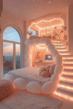 a bedroom decorated in white with lots of lights on the wall and stairs leading up to it