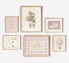 several framed pictures hang on the wall with pink and white designs, including a teddy bear