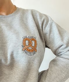 The best shirt for watching reruns and channeling your inner Stanley.  The embroidery design is made by LBD Embroidery, so you will not find this EXACT design anywhere else! Unisex fit Please allow up to 4 weeks for shipping. If you would like a different color sweatshirt or a t-shirt, please send me a message!  All sales are final. No refunds or exchanges. Pretzel Embroidery, Pretzel Day, Color Sweatshirt, Best Shirt, Cool Shirts, Embroidery Design, Sweat Shirt, Embroidery Designs, Knitted Sweaters