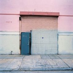 an open garage door on the side of a building