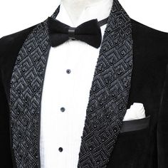 Package Includes: 1 x Jacket - 1 x Pant

Step into the spotlight with our exclusive Black Velvet Tuxedo, adorned with eye-catching crystal bead details for an extra touch of elegance. This tuxedo combines the timeless charm of velvet with a hint of sparkle, perfect for making a statement at any high-end event.

 	Fabric: Velvet
 	Lining Fabric: Silk
 	Pattern: Plain
 	Buttons: Black Satin Fabric
 	Construction: Half Canvas
 	Seasonality: All Season
 	Jacket: Shawl Lapel,  Crystal Bead On Lapel, Elegant Tuxedo For Gala, Elegant Embellished Suits For Evening, Elegant Embellished Evening Suits, Tailored Elegant Tuxedo For Gala, Elegant Embellished Party Suits, Embellished Elegant Tuxedo For Formal Occasions, Elegant Embellished Tuxedo For Formal Occasions, Embellished Elegant Formal Tuxedo, Embellished Fitted Suits For Gala