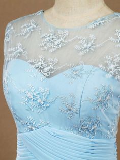 a light blue dress with white flowers on it