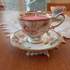 a cup and saucer on a wooden table