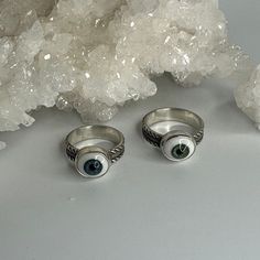 Fun and quirky 12mm glass doll eyes are the highlight of each of these rings.  The eyes are set in plain, sterling bezels with 5mm wide ring bands with a rope pattern design. 100% handmade using sterling (.925) silver. White Sterling Silver Novelty Jewelry, Novelty White Sterling Silver Jewelry, Glass Dolls, Rope Pattern, Ring Bands, Wide Ring, Wide Rings, Rope Design, Doll Eyes