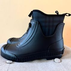 A Rubber Rain Boot With A Removable Check Neoprene Sole And A Decorative Front Zip. Upper: 70% Rubber , 30% Polyester Lining: 100% Polyester Slip On Style New With Box Black Ankle Rain Boots With Rubber Sole, Burberry Black, Burberry Shoes, Rain Boot, Winter Rain, Rubber Rain Boots, Rain Boots, Burberry, Slip On