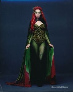 a woman with red hair wearing a costume