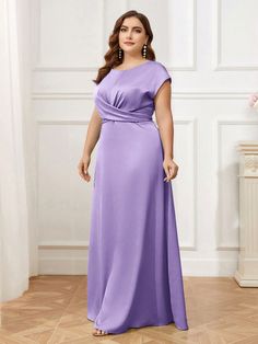 a woman in a long purple dress