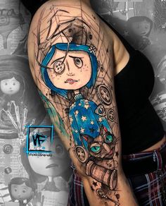 a woman's arm with a cartoon character on it and an image of a cat