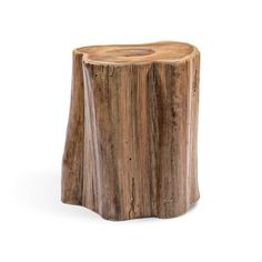 a wooden table that has been made out of tree trunks and is sitting on a white surface