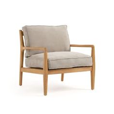 a wooden chair with a white cushion on it's back and armrests