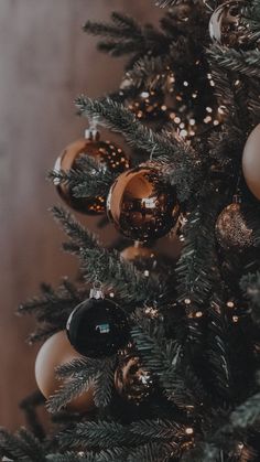 a christmas tree with ornaments hanging from it