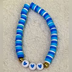 -Handmade Clay Bead Bracelet With White,Blue,Gold, And Heart Bead-Great Condition /Never Worn -Stretchy White Clay Bead Bracelet, Make Clay Beads, Colorful Bead Bracelets, Clay Bead Necklace, Beaded Braclets, Preppy Bracelets, Homemade Bracelets, Clay Bead Bracelet, Blue Beaded Bracelets