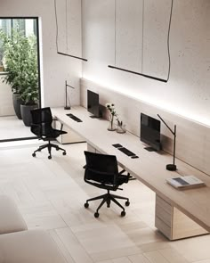 an empty office with two desks and chairs