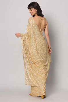 Festive Gold Embellished Pre-draped Saree, Festive Gold Pre-draped Saree With Mirror Work, Glamorous Gold Lehenga With Mirror Work, Gold Embellished Dupatta For Reception, Festive Gold Pre-draped Saree With Sequins, Fitted Gold Pre-draped Saree For Festive Occasions, Elegant Gold Lehenga With Zari Work, Elegant Gold Embroidered Lehenga, Traditional Gold Embellished Saree