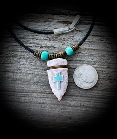 "You are considering an arrowhead that I hand carved from a piece of whitetail antler. I relief carved a Cross and then inlaid crushed turquoise into it. Beautiful detail! It is hand-knapped it to give it the appearance of a genuine arrowhead. The whole piece was sealed with a quality clear enamel. I think it turned out quite nice! It is strung on a 24\" 3mm round leather cord with an easy snap lock closure. Please let me know if you would like the cord to be a different length. VERY NICE with a Southwestern Arrowhead Jewelry Gift, Southwestern Style Arrowhead Jewelry Gift, Deer Antler Necklace, Deer Antlers Necklace, Western Stuff, Antler Art, Mens Necklace Pendant, Antler Necklace, Astrology Necklace