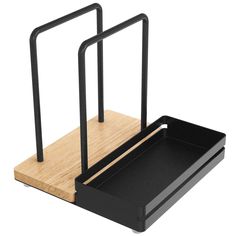 two black metal and wood desk accessories on a white background with clippings to the sides