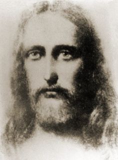 an old black and white photo of a man with long hair