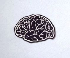 a black and white image of a brain on a piece of paper that has been cut out