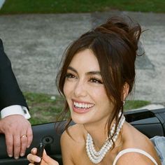 a woman sitting in the back seat of a car