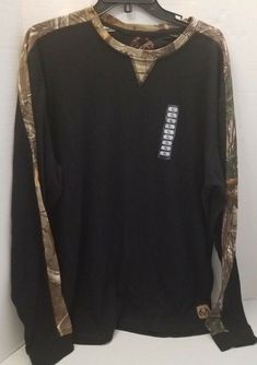 NWT REALTREE LONG SLEEVE MENS THERMO SHIRT BLACK with CAMO GRAPHIC DESIGN "SEE IT IN ACTION" SIZE XL DESCRIPTION: NEW REALTREE PART SOLID BLACK PARTS GRAPHIC - CAMO in BROWNS CREW NECK PULL OVER LONG SLEEVE SIZE XL LOOK AT PICTURES - FROM ALL SIDES - MIGHT BE GLARE FROM outdoor - LET US KNOW IF YOU NEED MORE SIZE L (THE SAME SHIRT) MEN'S 60% COTTON 40% POLYESTER THE STYLE LOOKS VERY FITTED and LONG MEASUREMENTS (FLAT): ARM PIT TO ARM PIT about 24" BACK TOP COLLAR MIDDLE TO HEM about 29" LENGTH O Black Long Sleeve Shirt Outfit, T Shirt Over Long Sleeve, Camouflage Long Sleeve Sweatshirt For Streetwear, Black Long Sleeve Outfit, Long Sleeve Camo Shirt, Camouflage Long Sleeve Cotton Shirt, Type O Negative Shirt, Long Sleeve Camouflage Cotton Shirt, Thermo Shirt