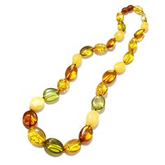 Stunning! Stones: Baltic Butter Scotch and Cognac Amber and Green Caribbean Amber (color enhanced) SKU: AMNK103022-01 Dimensions: Largest center stone is approx. 1" long x 3/4" wide x 1/2" depth Length: There are 2 length options: 19" and 24" There is no metal in this necklace Made in: Lithuania Butter Scotch, Amber Color, Medium Long, Lithuania, Tri Color, Scotch, Cognac, Amber, Statement Necklace